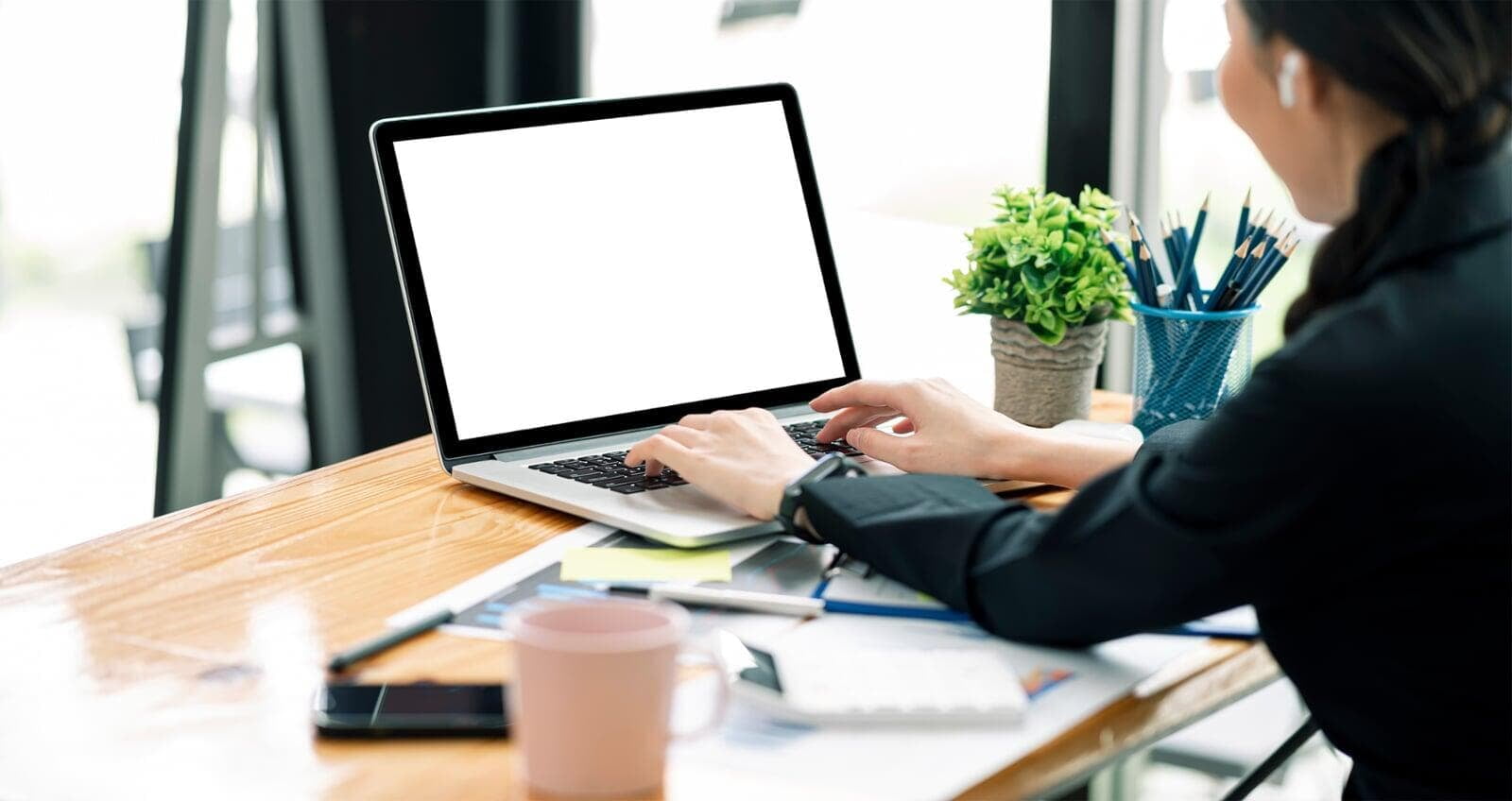 High school aged student with laptop. 